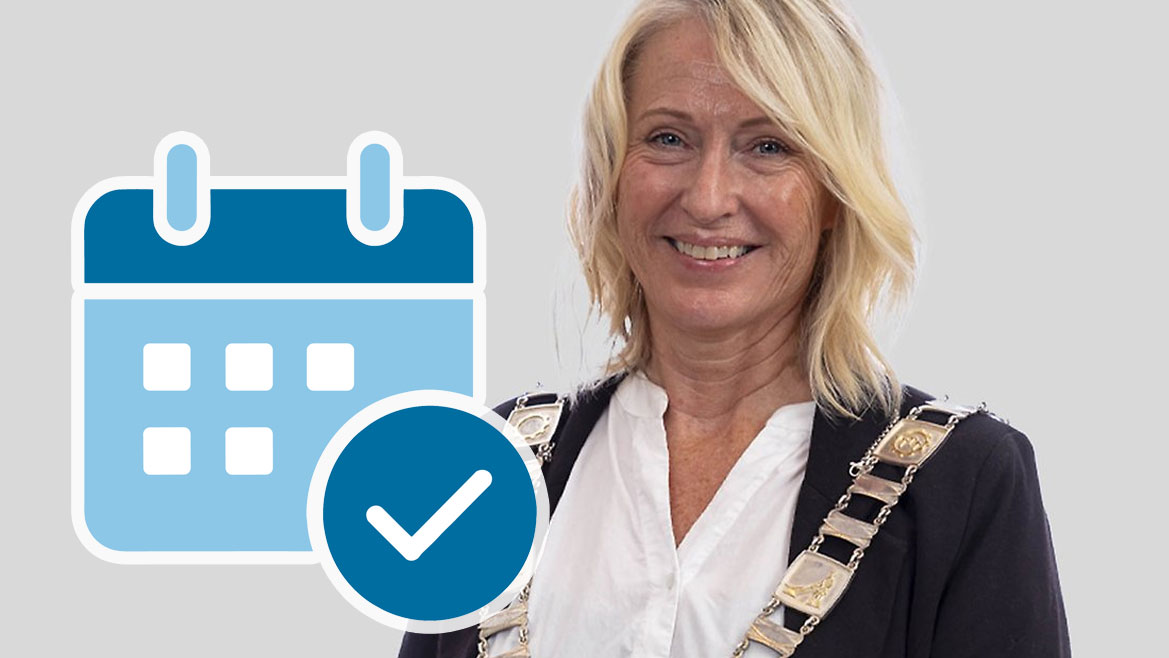 Ordfører sammen med en kalender